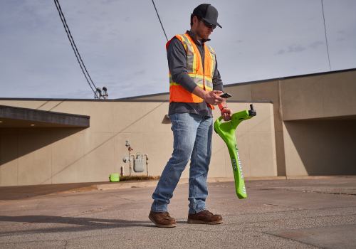 Utility locator tracing buried lines with a handheld locator
